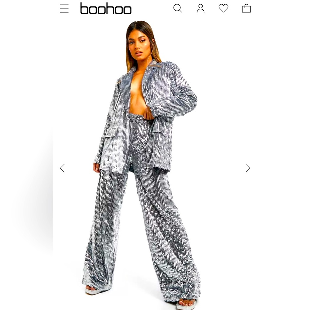 Great pant  suit ,silver sequin intact size 16 satin lined demand to be seen